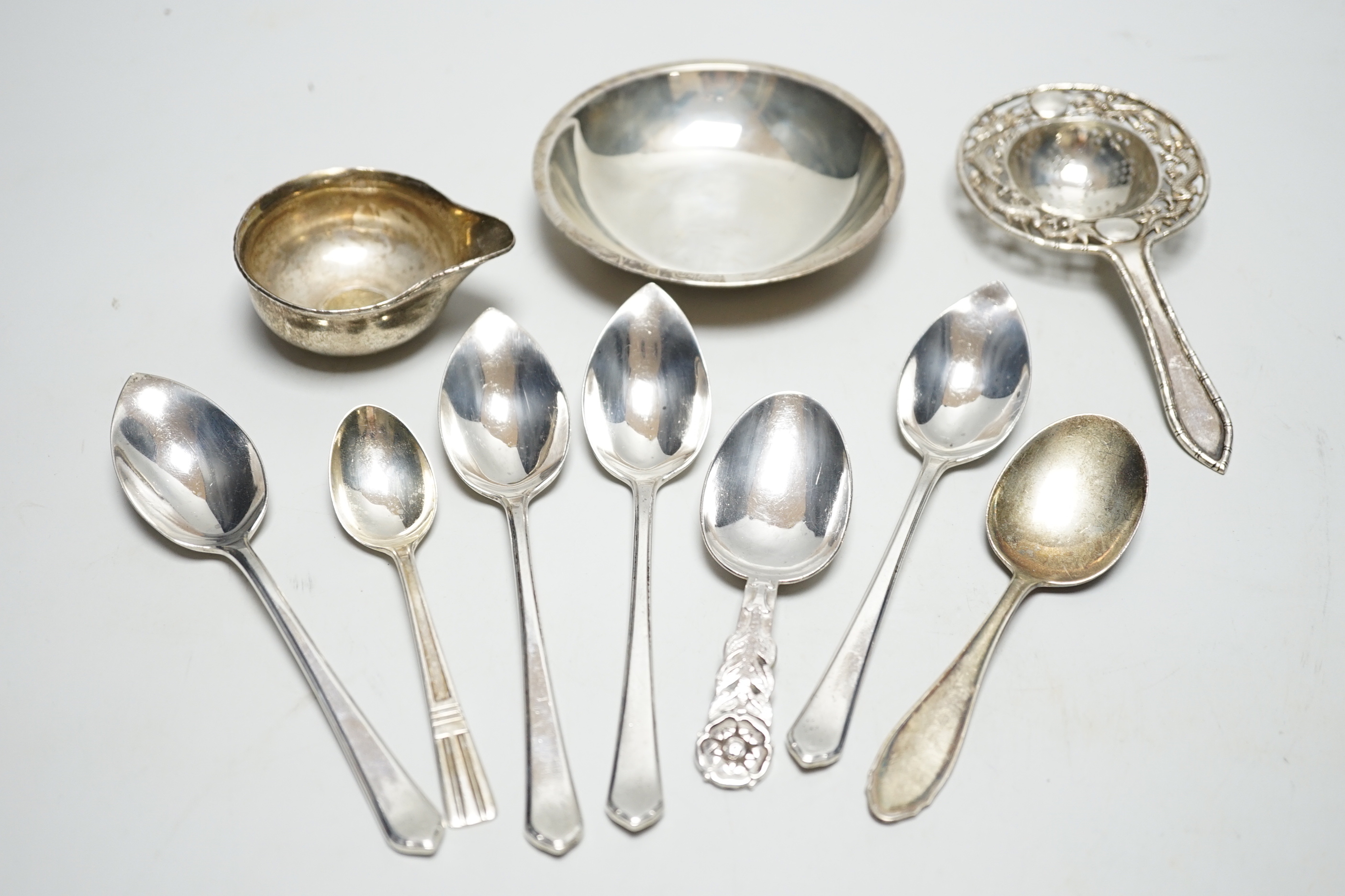 An Elizabeth II silver spoon by Robert Edgar Stone, London, 1957, 10.1cm and sundry silver flatware etc.